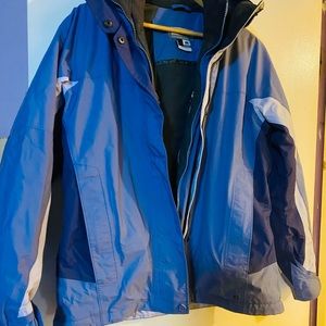 This coat is two tone light blue and navy this coat has a removable inner jacket